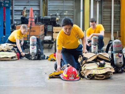 student packing uniform in firefighting